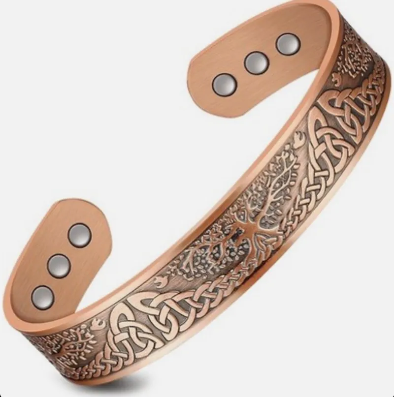 Copper cuff bracelet with an engraved Tree of Life pattern